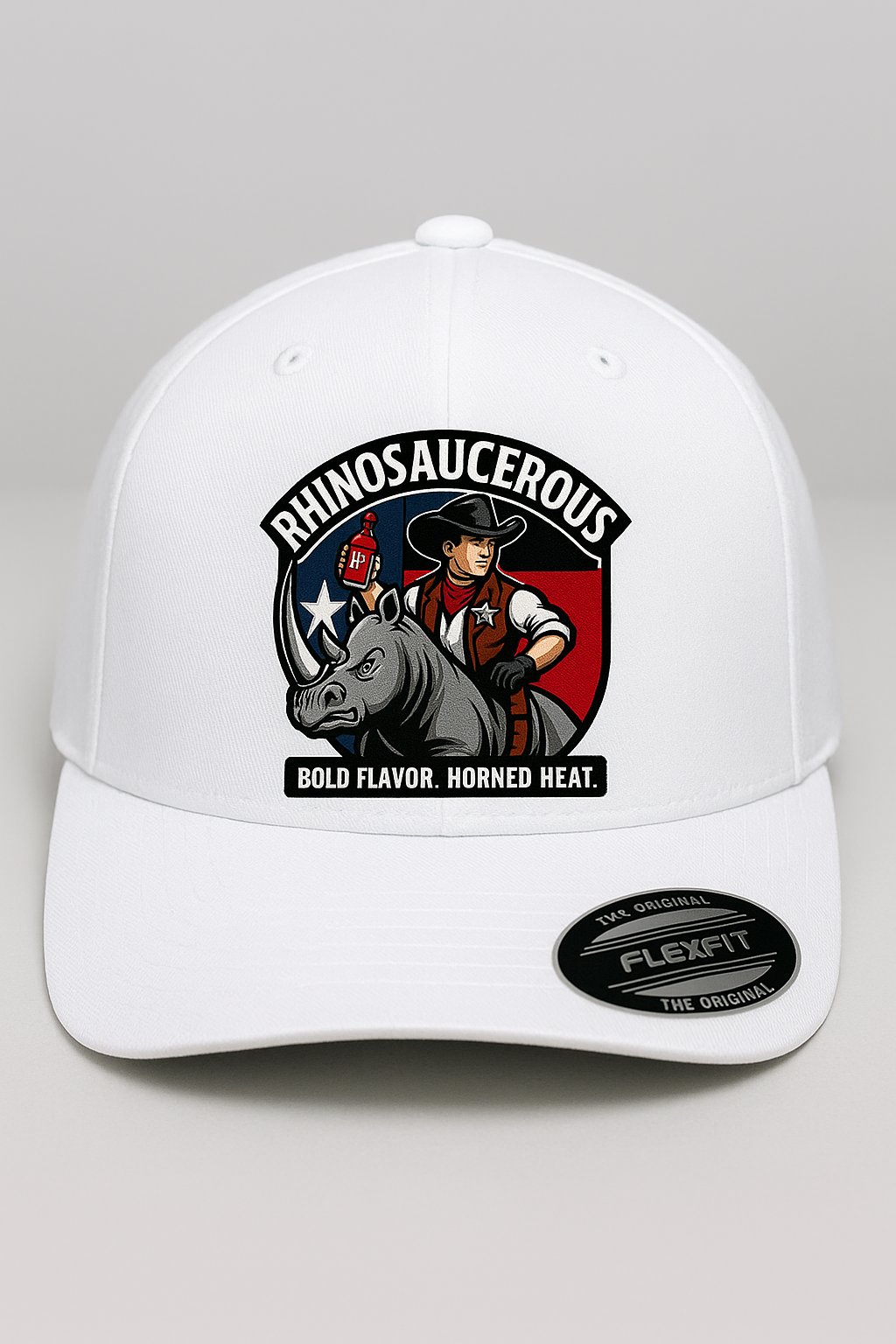 White cap with rhino and cowboy graphic and 'Rhinosaucerous' text on a gray background
