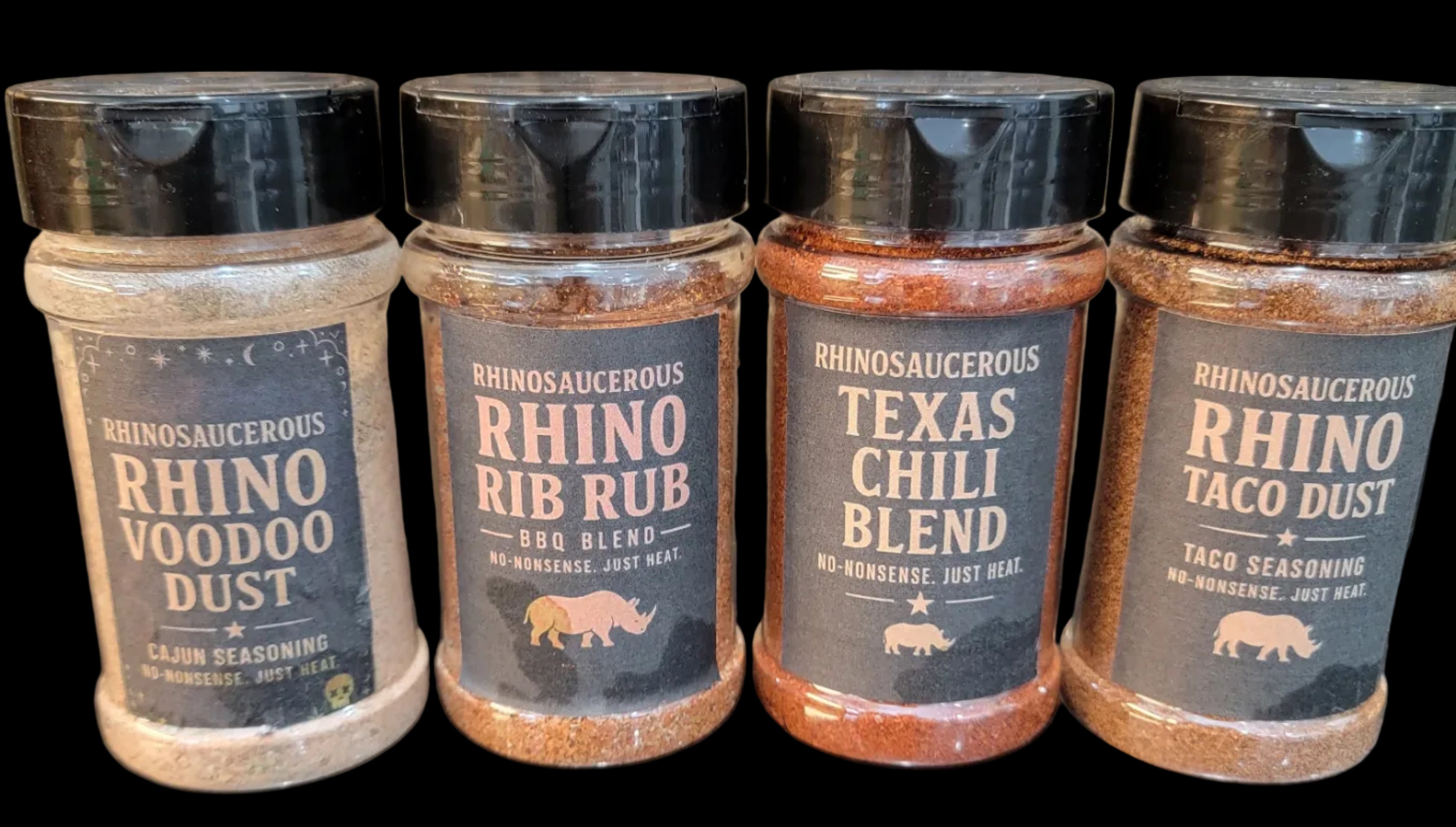 The full set of RhinoSaucerous Spice Blends on a wooden surface